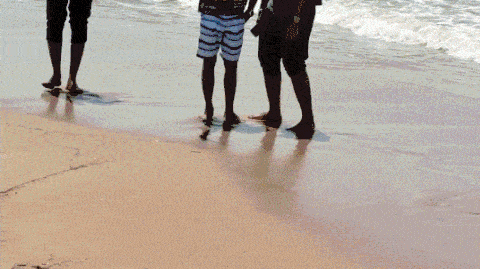 Man sitting on train looking out window